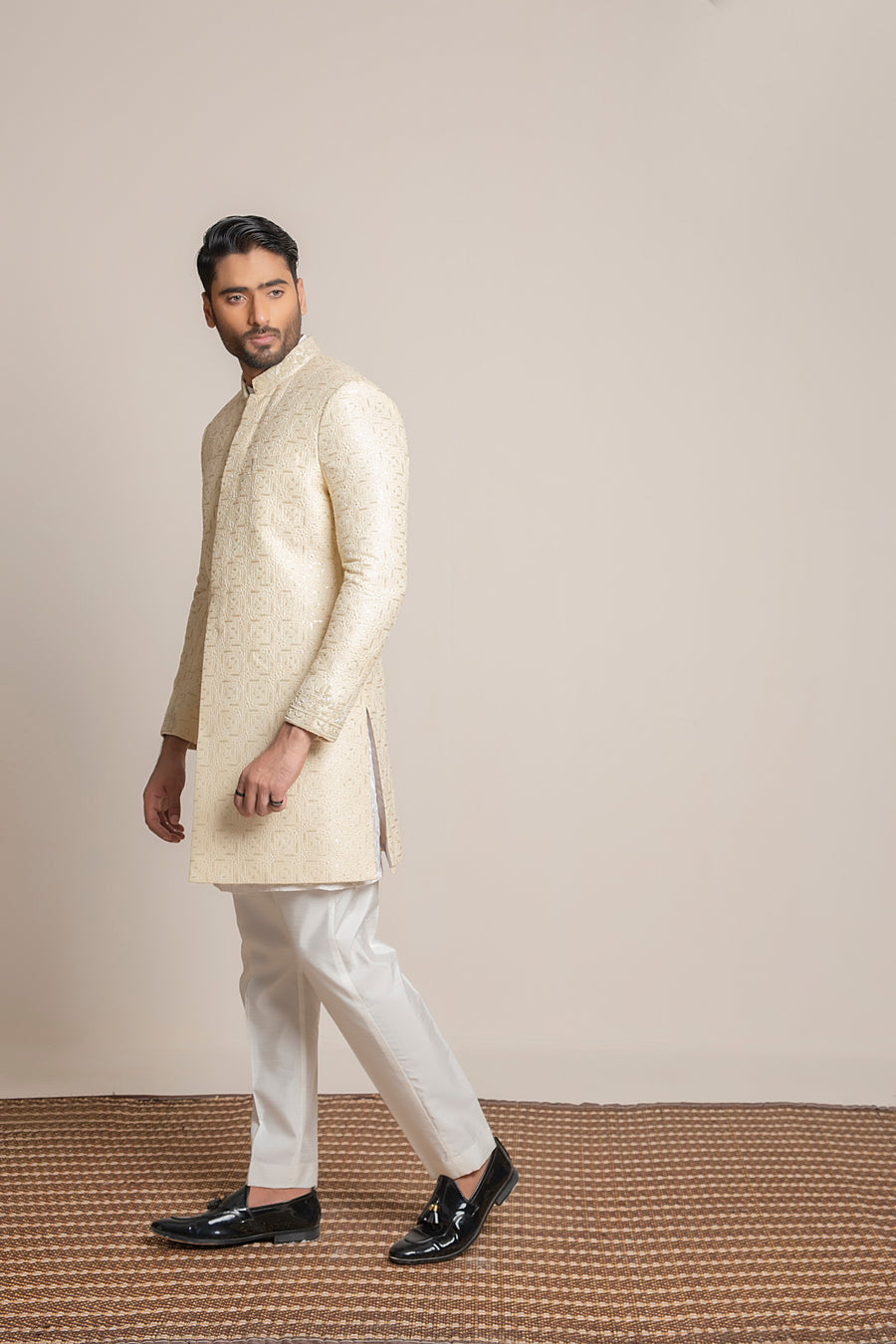 Cream embroidered Sherwani with hand work on collar and sleeves