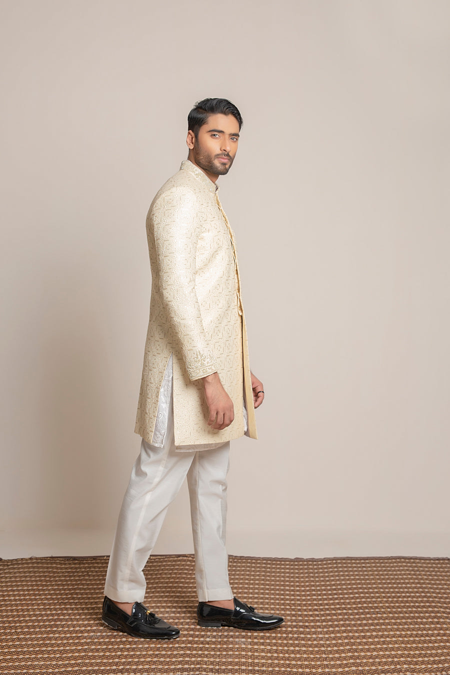 Cream embroidered Sherwani with hand work on collar and sleeves