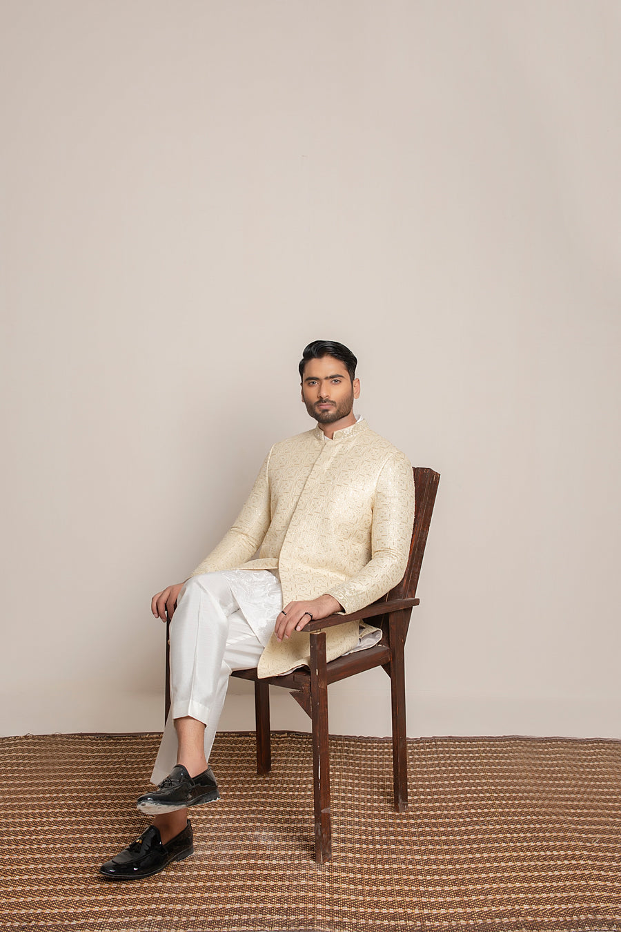 Cream embroidered Sherwani with hand work on collar and sleeves